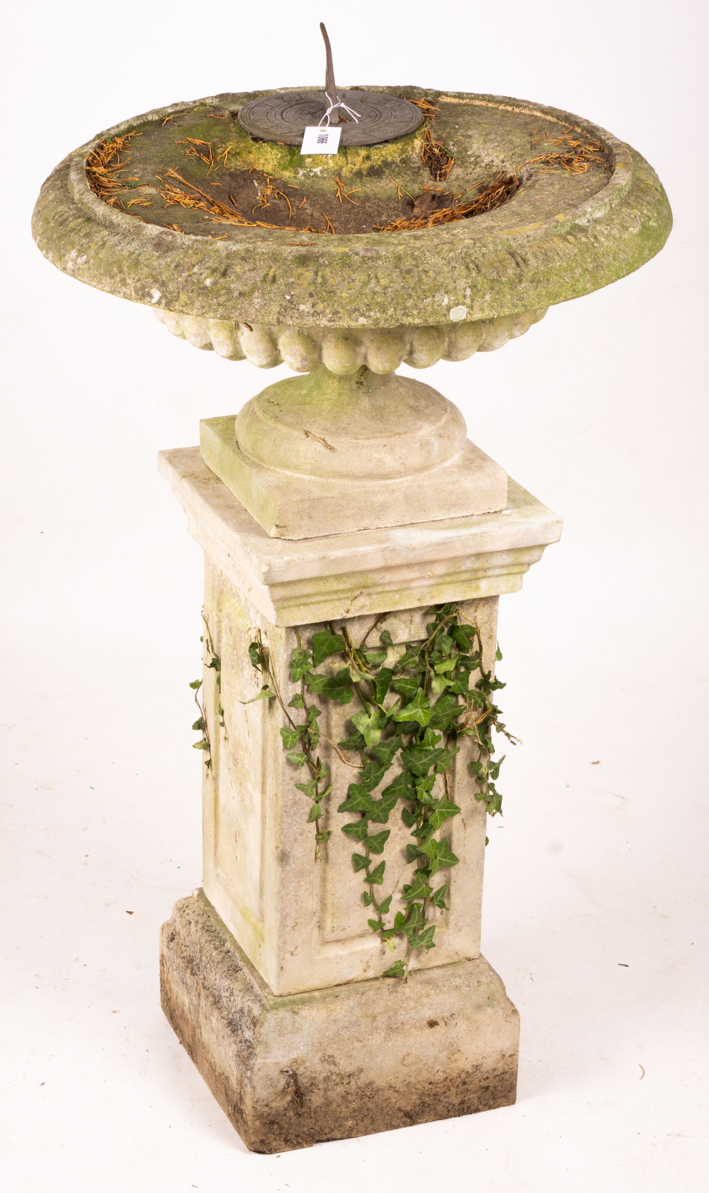 A reconstituted stone garden bird bath combined sundial on square pedestal base, height 108cm